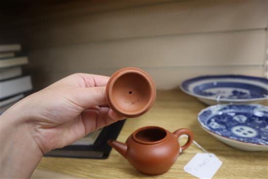 A Chinese Yixing teapot, a Chinese blue and white plate and a Japanese dish (3)